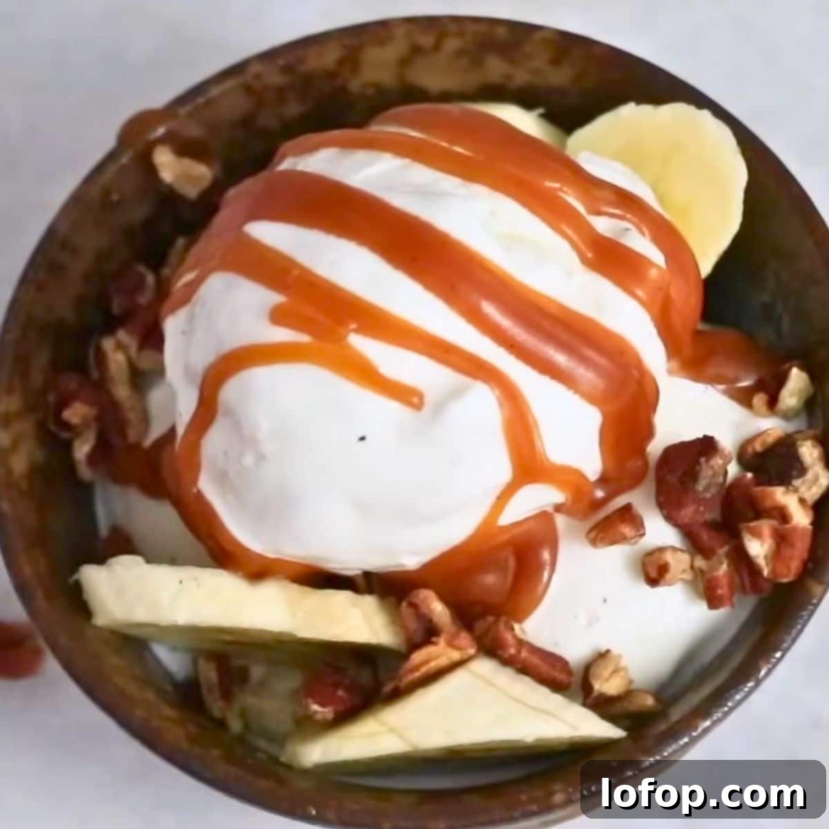 Homemade caramel sauce on vanilla ice cream