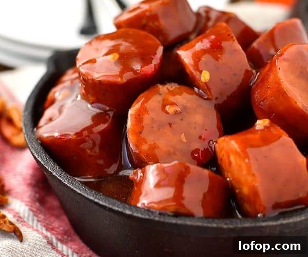 Sweet chili BBQ meatballs in a black bowl.