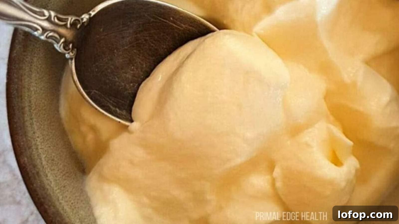 15 Decadent Low-Calorie Desserts That No One Will Suspect Are Light 6 A spoon dipping into a bowl of cheesecake fluff.