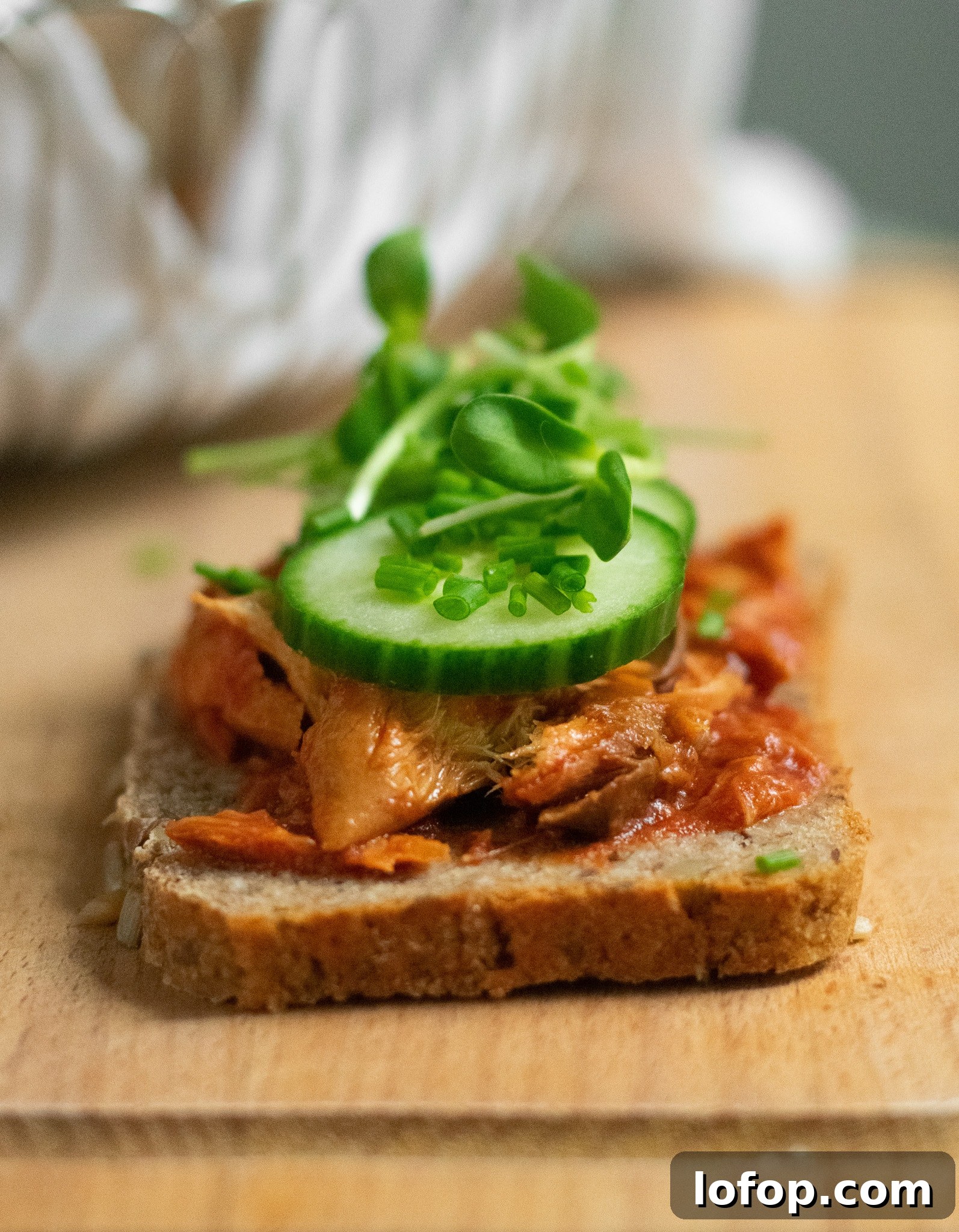 Smørrebrød: Traditional Danish Open-Faced Sandwich Recipes 13 A rye bread open faced sandwich topped with mackerel in tomato sauce, cucumber, chives, and micro greens.