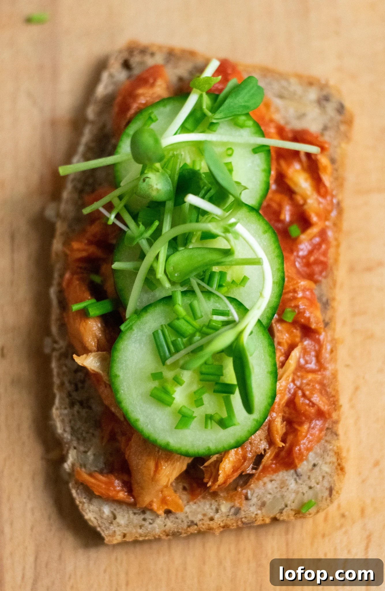 Smørrebrød: Traditional Danish Open-Faced Sandwich Recipes 14 A rye bread open faced sandwich topped with mackerel in tomato sauce, cucumber, chives, and micro greens.