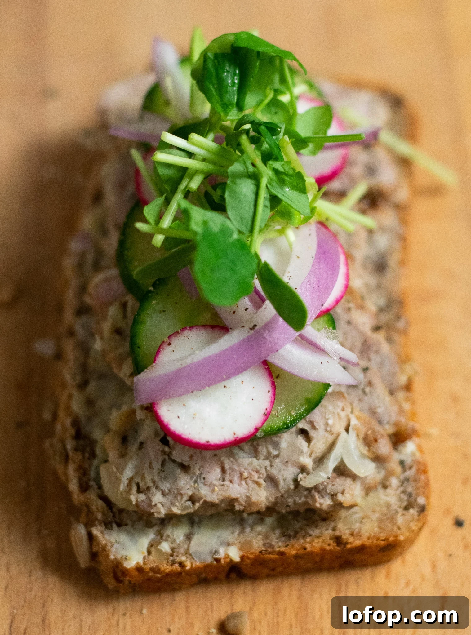 Smørrebrød: Traditional Danish Open-Faced Sandwich Recipes 20 A rye bread open faced sandwich topped with danish meatballs, cucumber, radish, onion, and micro greens.