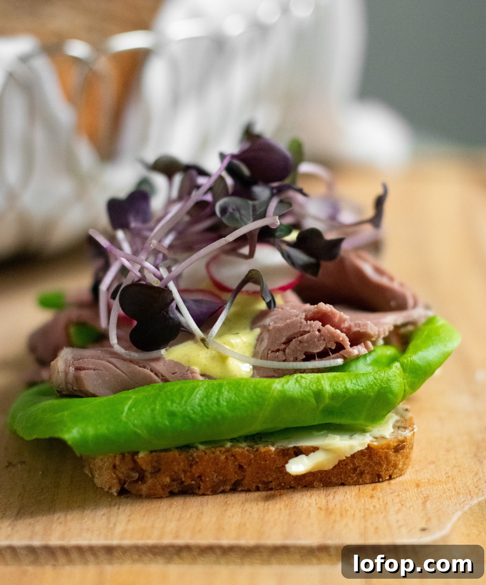 Smørrebrød: Traditional Danish Open-Faced Sandwich Recipes 23 A rye bread open faced sandwich topped with lettuce, roast beef, remoulade, radish, and micro greens.