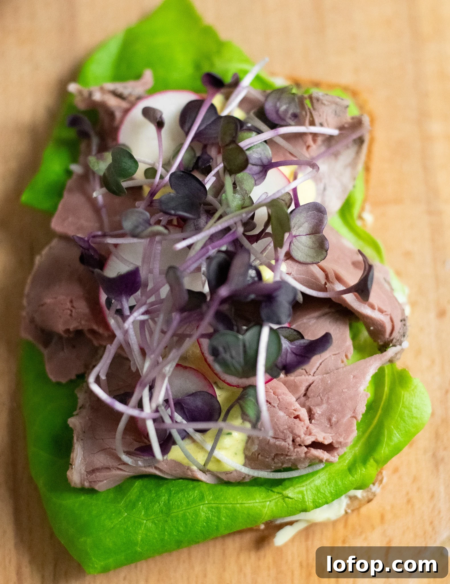 Smørrebrød: Traditional Danish Open-Faced Sandwich Recipes 24 A rye bread open faced sandwich topped with lettuce, roast beef, remoulade, radish, and micro greens.