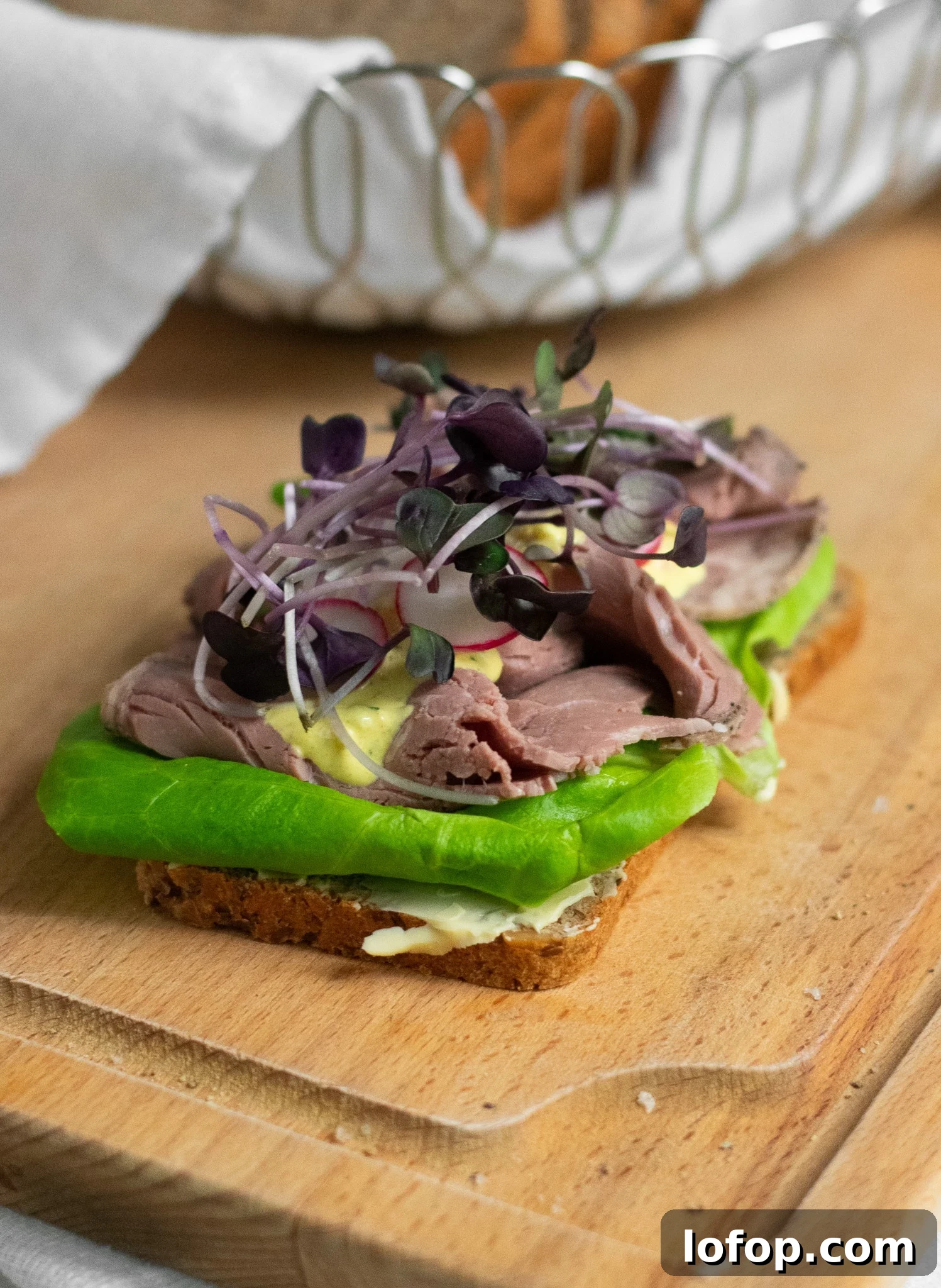 Smørrebrød: Traditional Danish Open-Faced Sandwich Recipes 33 A rye bread open faced sandwich topped with lettuce, roast beef, remoulade, radish, and micro greens.