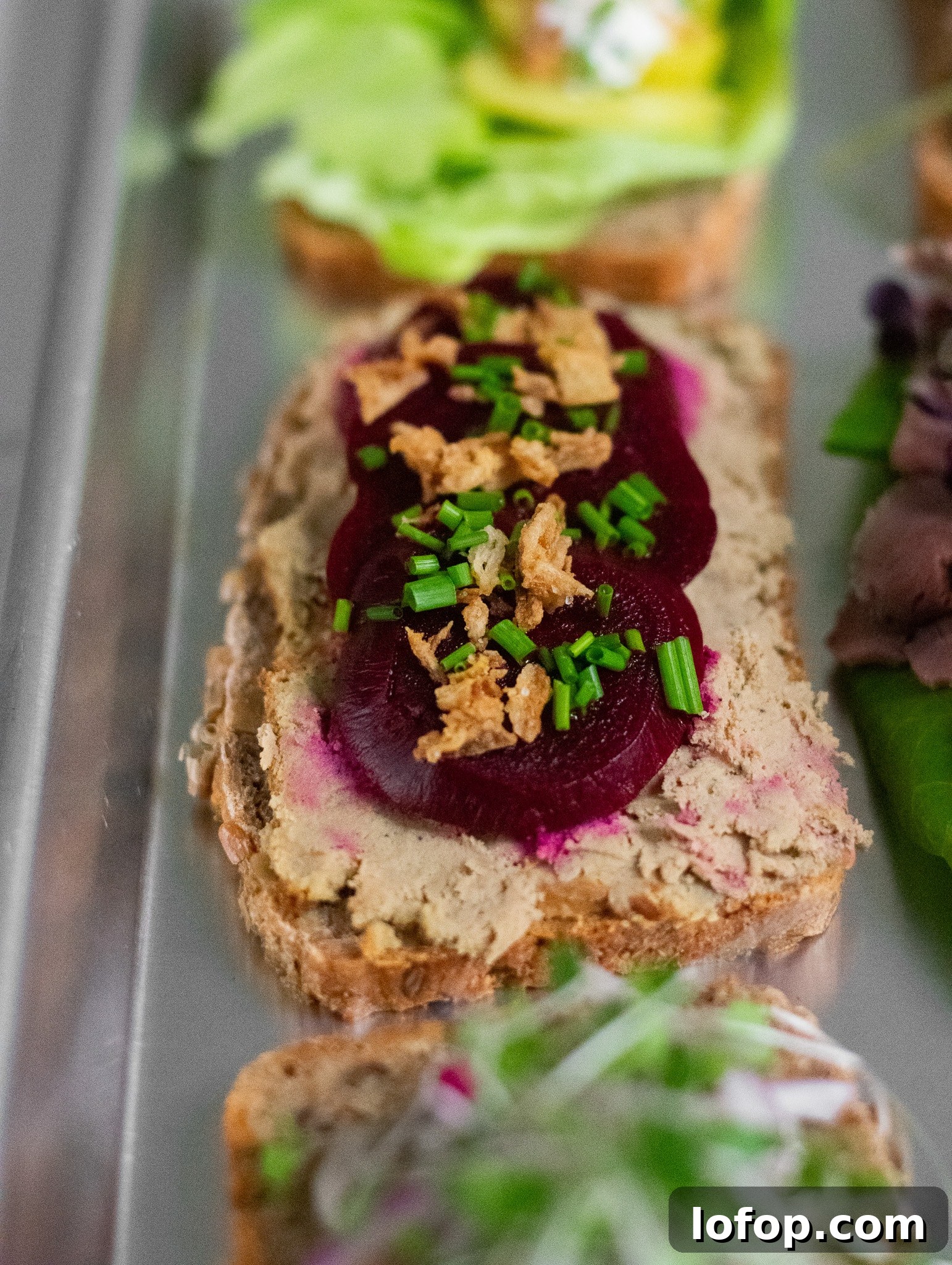 Smørrebrød: Traditional Danish Open-Faced Sandwich Recipes 6 A rye bread open faced sandwich topped with liver pate, pickled beets, and fried onions.