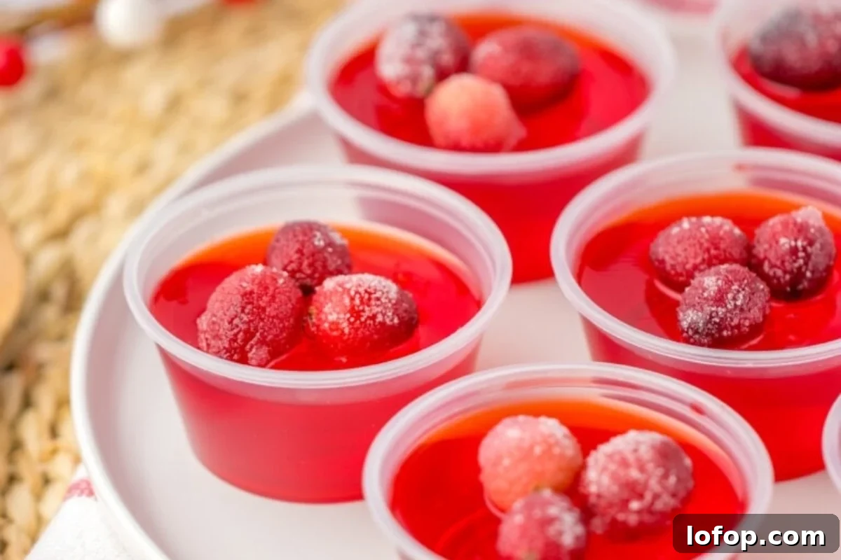 29 Jello Shot Recipes to Kick Off Any Party Night 18 Cranberry jellies in red plastic cups on a plate.