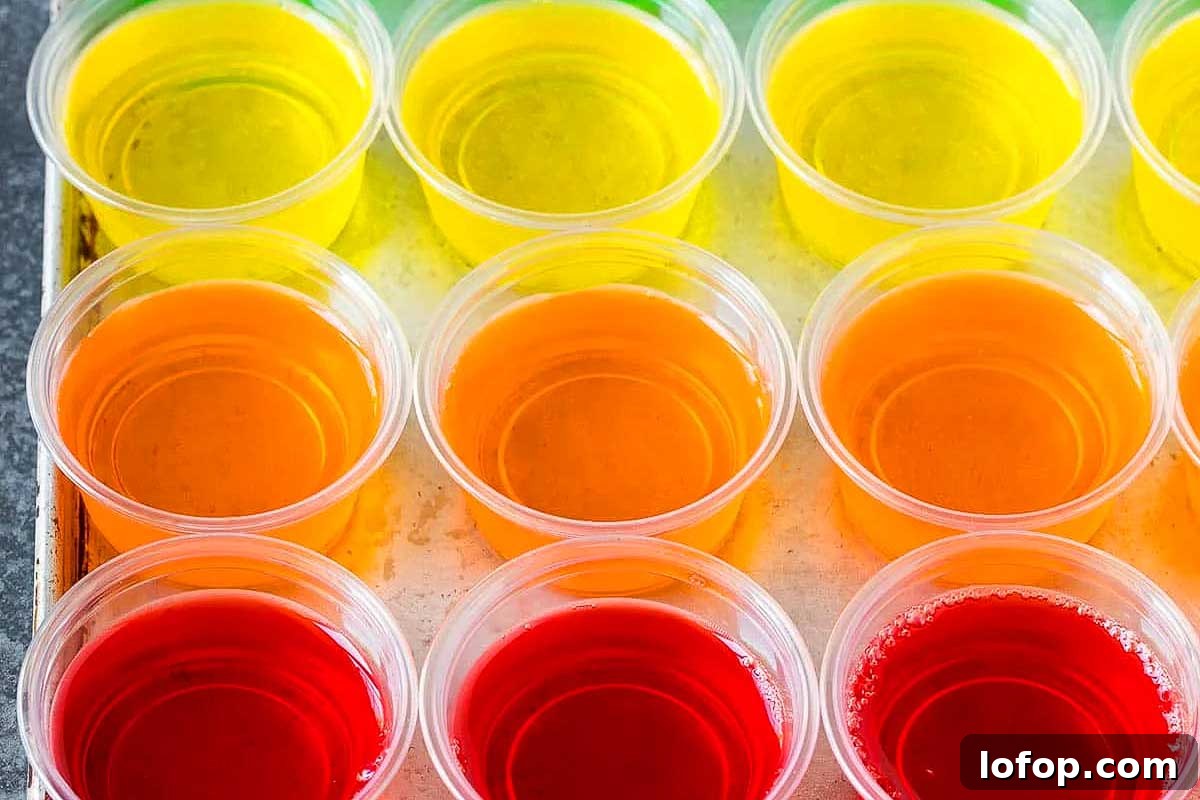 29 Jello Shot Recipes to Kick Off Any Party Night 21 A tray of jello shots in vibrant shades.