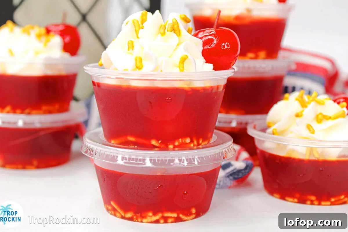 29 Jello Shot Recipes to Kick Off Any Party Night 24 A group of plastic cups filled with jello shots.