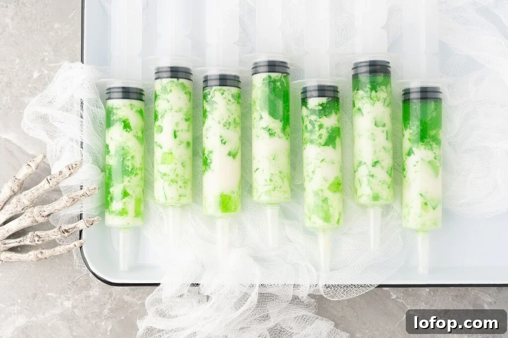 29 Jello Shot Recipes to Kick Off Any Party Night 6 A tray of green and white popsicles infused with Smirnoff lime vodka.
