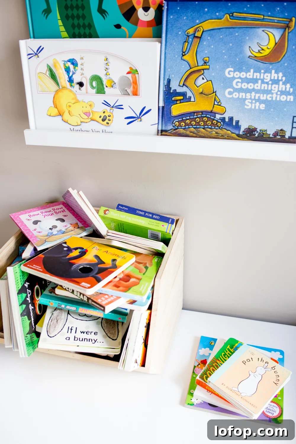 Declutter Your Child’s Bookshelf: Practical Steps That Stick 2 kids books in a modern bright playroom