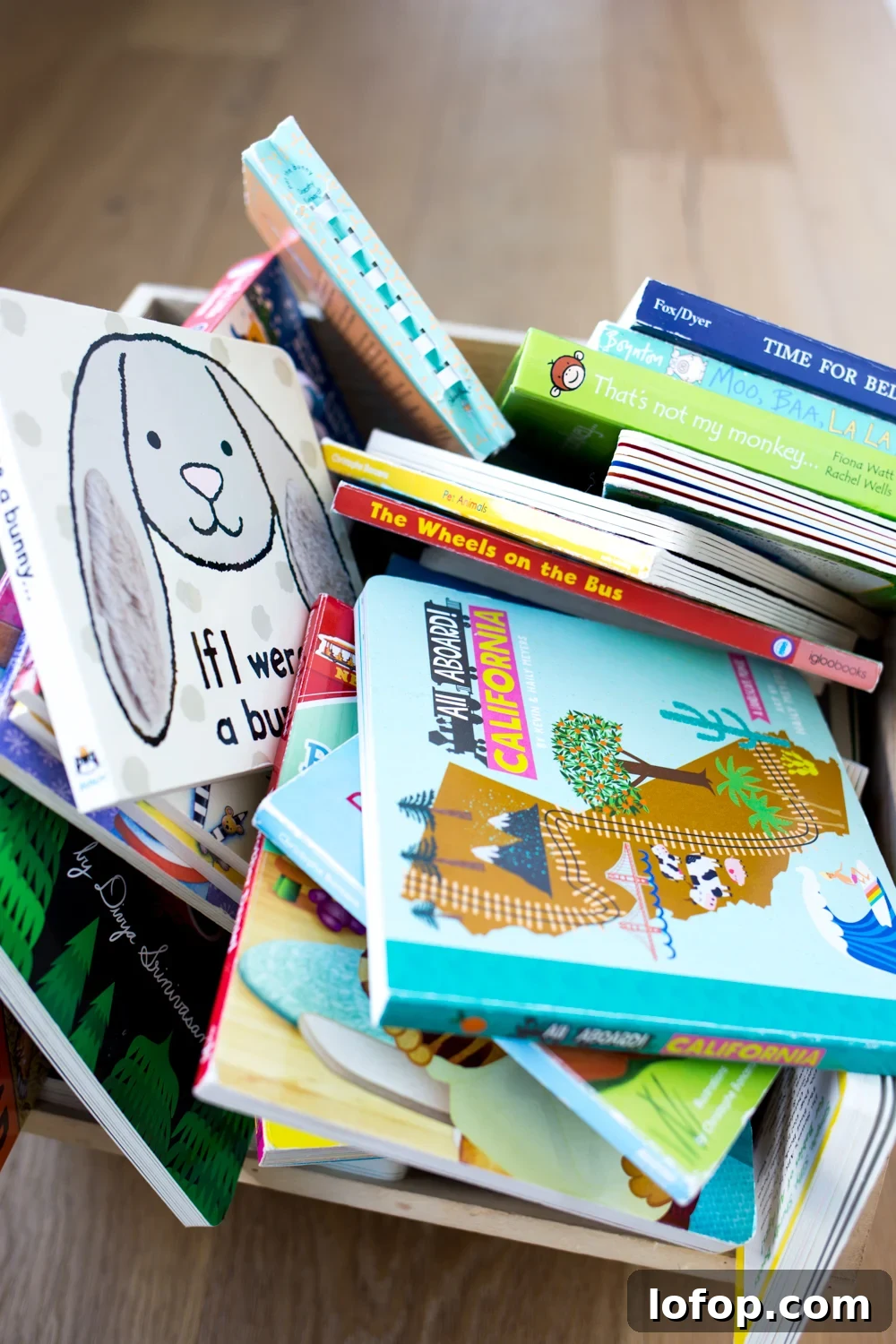 Declutter Your Child’s Bookshelf: Practical Steps That Stick 3 Pile of children's books in a wooden bin