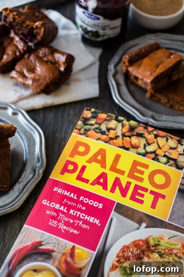 These paleo gingerbread blondies are packed full of holiday flavor. 100% Paleo made with almond butter, honey, warm spices and black currant jam.