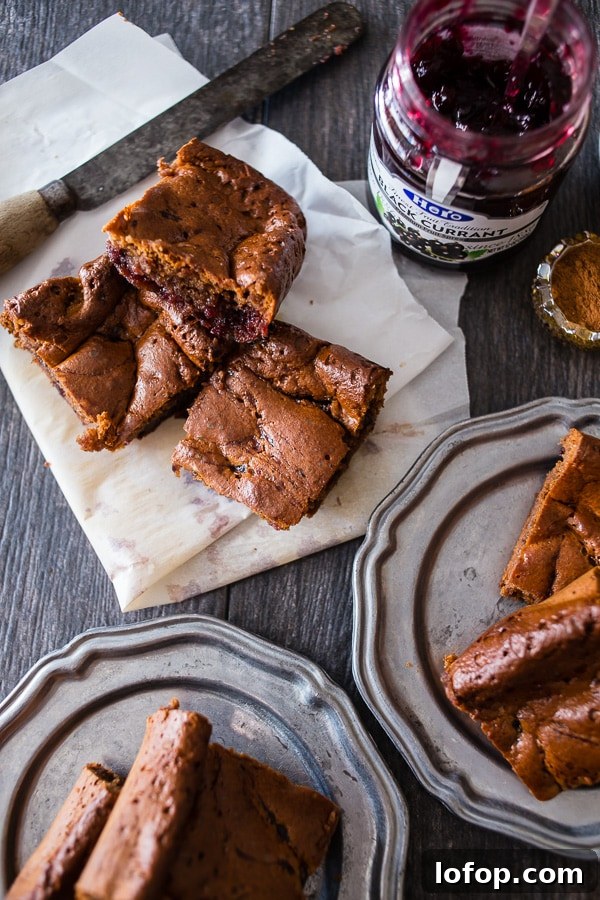 These paleo gingerbread blondies are packed full of holiday flavor. 100% Paleo made with almond butter, honey, warm spices and black currant jam.