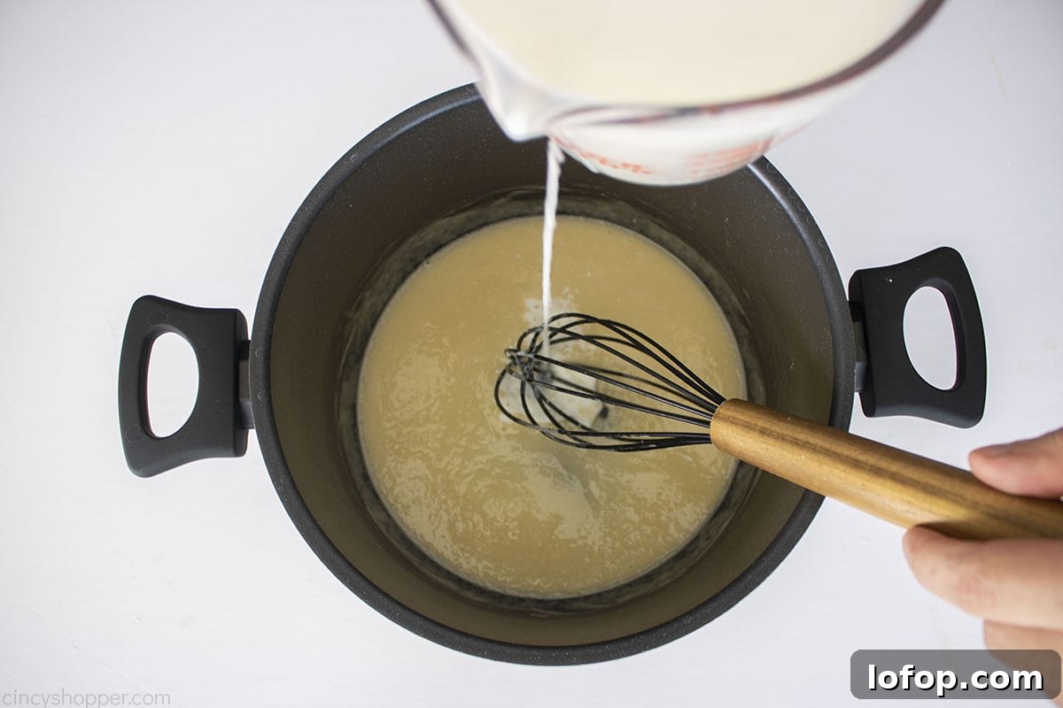Milk added to flour roux.