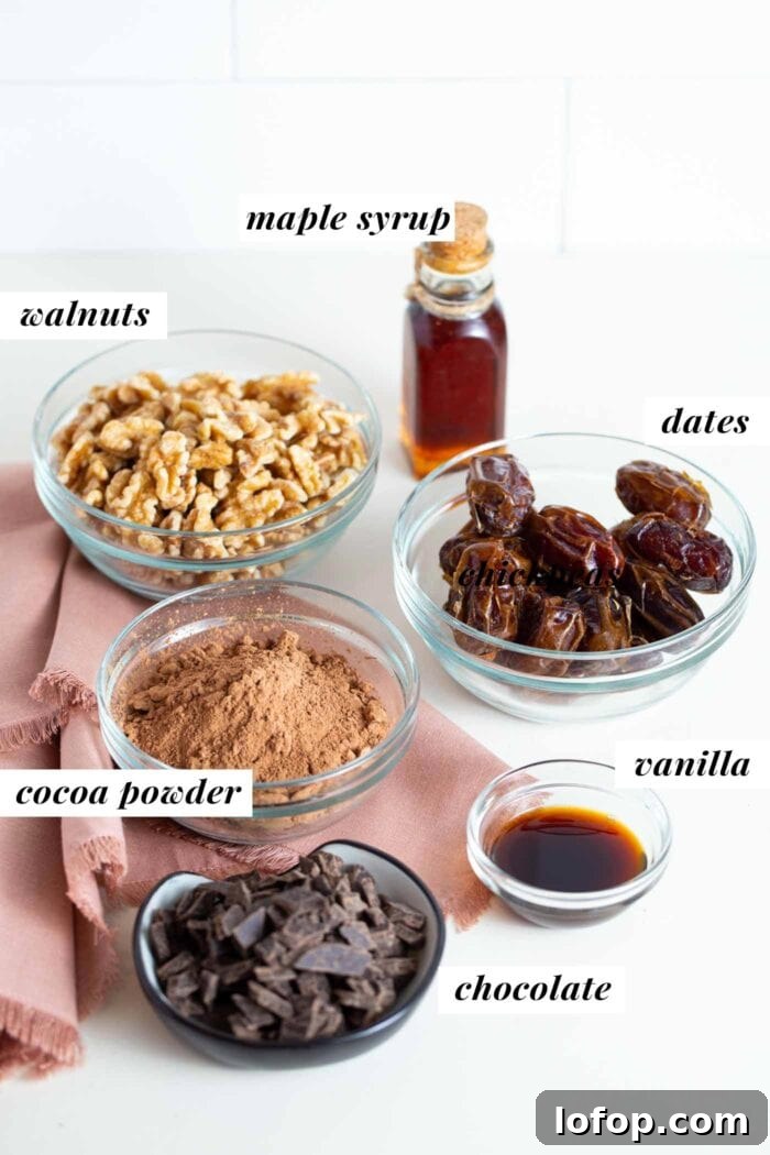 Vegan No-Bake Chocolate Brownies — Quick Raw Dessert Recipe 3 Chocolate, cocoa powder, walnuts, dates and vanilla in labelled containers.