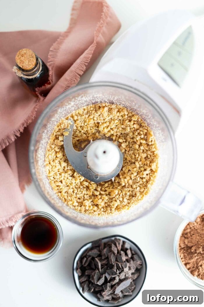 Vegan No-Bake Chocolate Brownies — Quick Raw Dessert Recipe 4 Blended walnuts in a food processor.